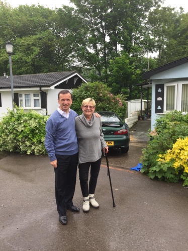 Alun Cairns with park home owner Jo Cody